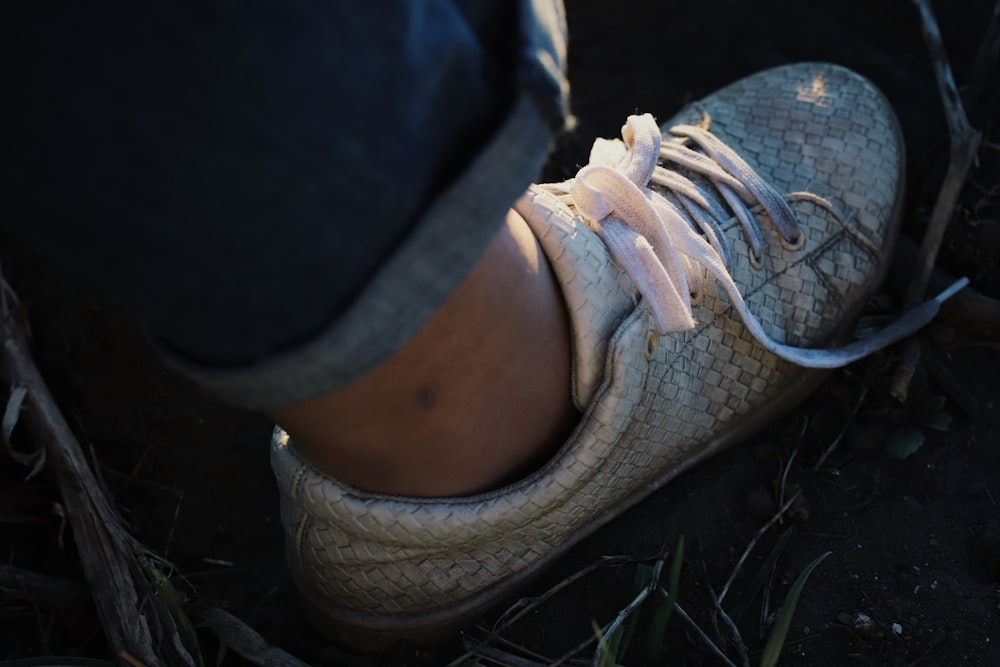 person wearing brown and white running shoes