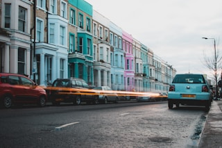 blue and brown bus on road near building during daytime