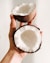 person holding white and black round ornament