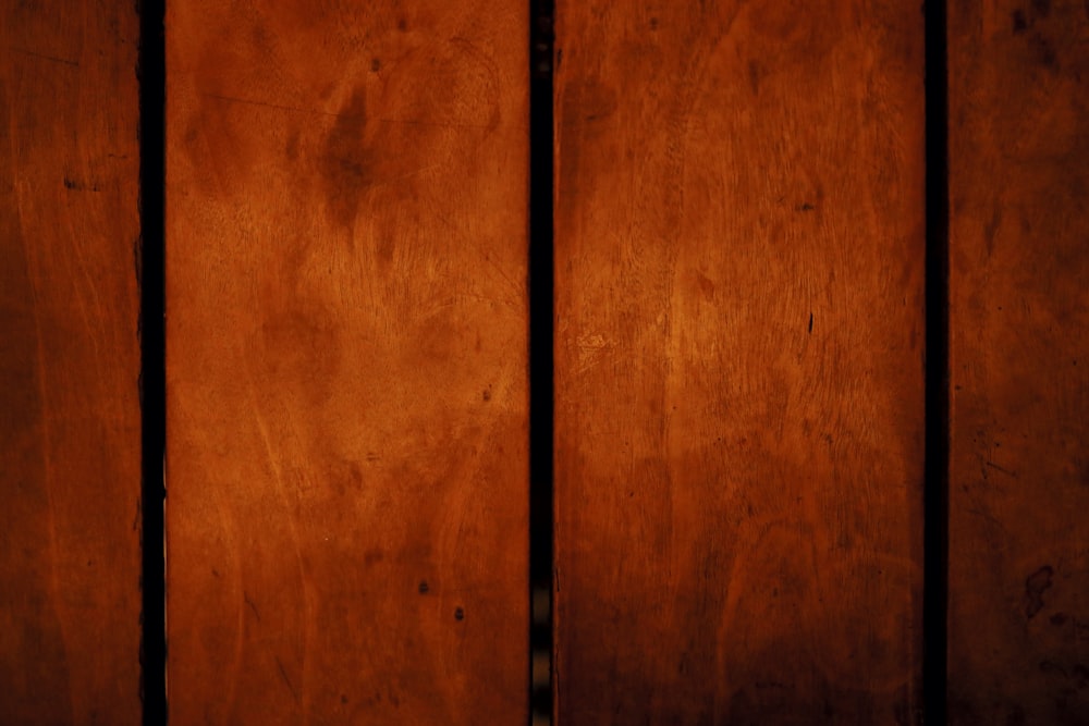 black metal rod on brown wooden surface