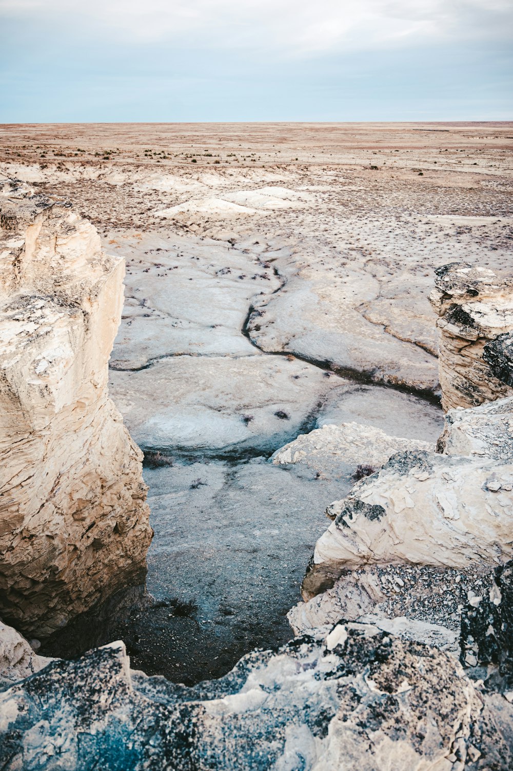 brown rock formation on brown field during daytime