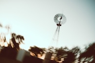 Time-lapse sequence of airflow simulation around an architectural model under varying wind conditions.