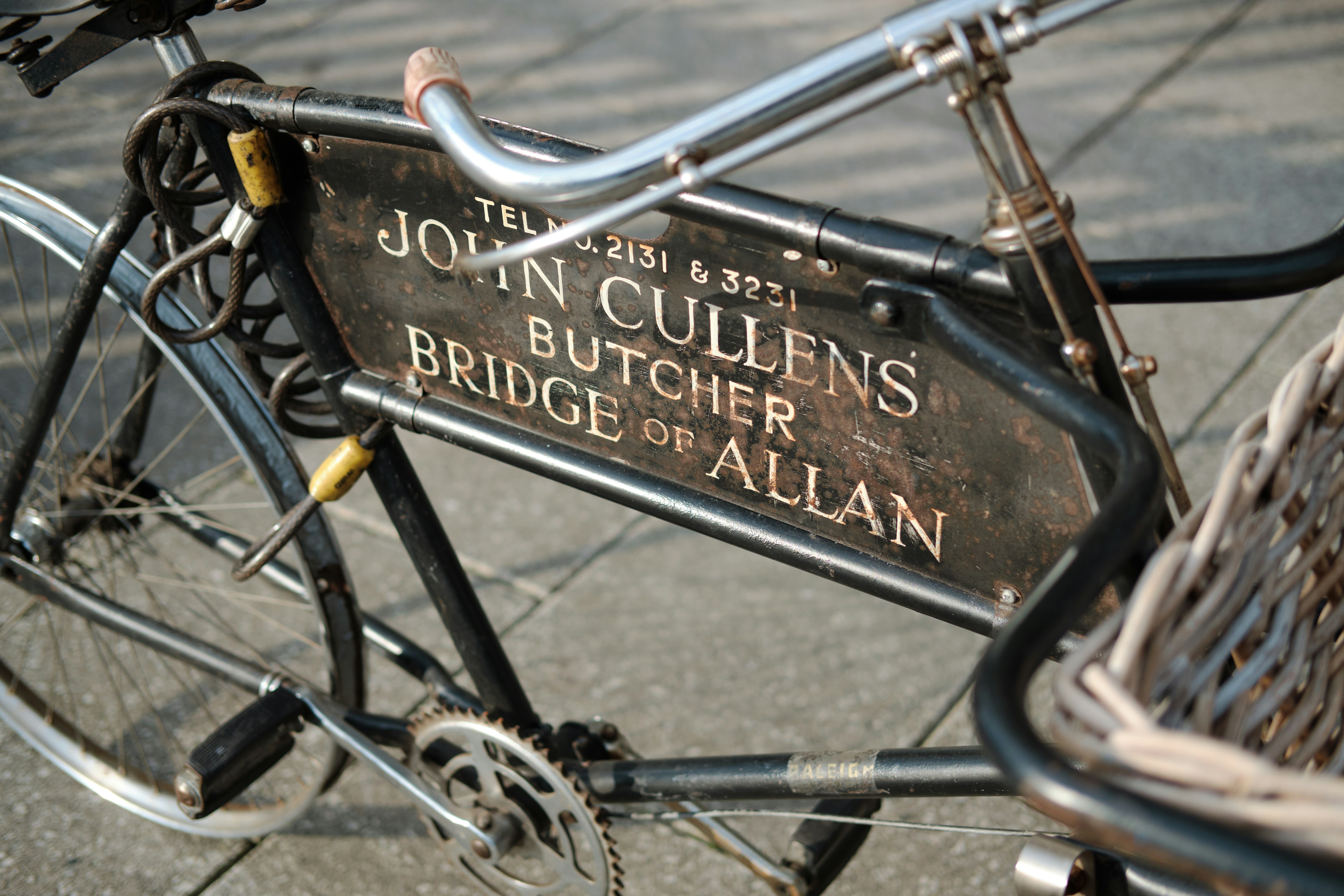 black bicycle with black metal fence