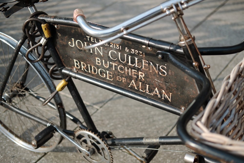 black bicycle with black metal fence