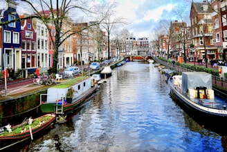 boat on river near buildings during daytime
