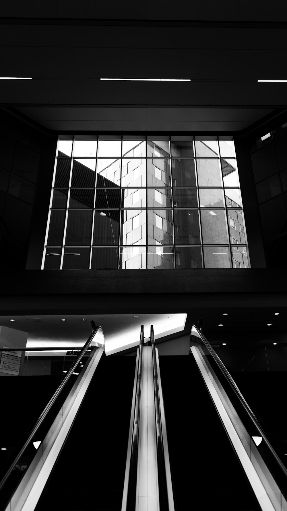 grayscale photo of a glass window