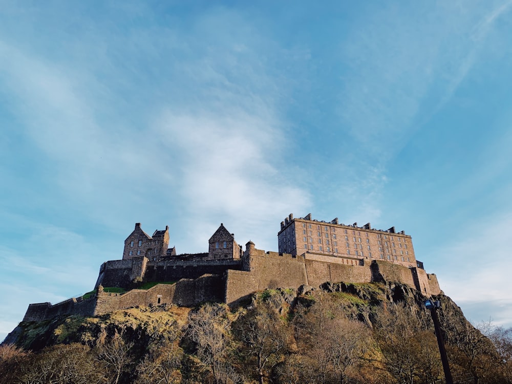 brown concrete castle under blue sky