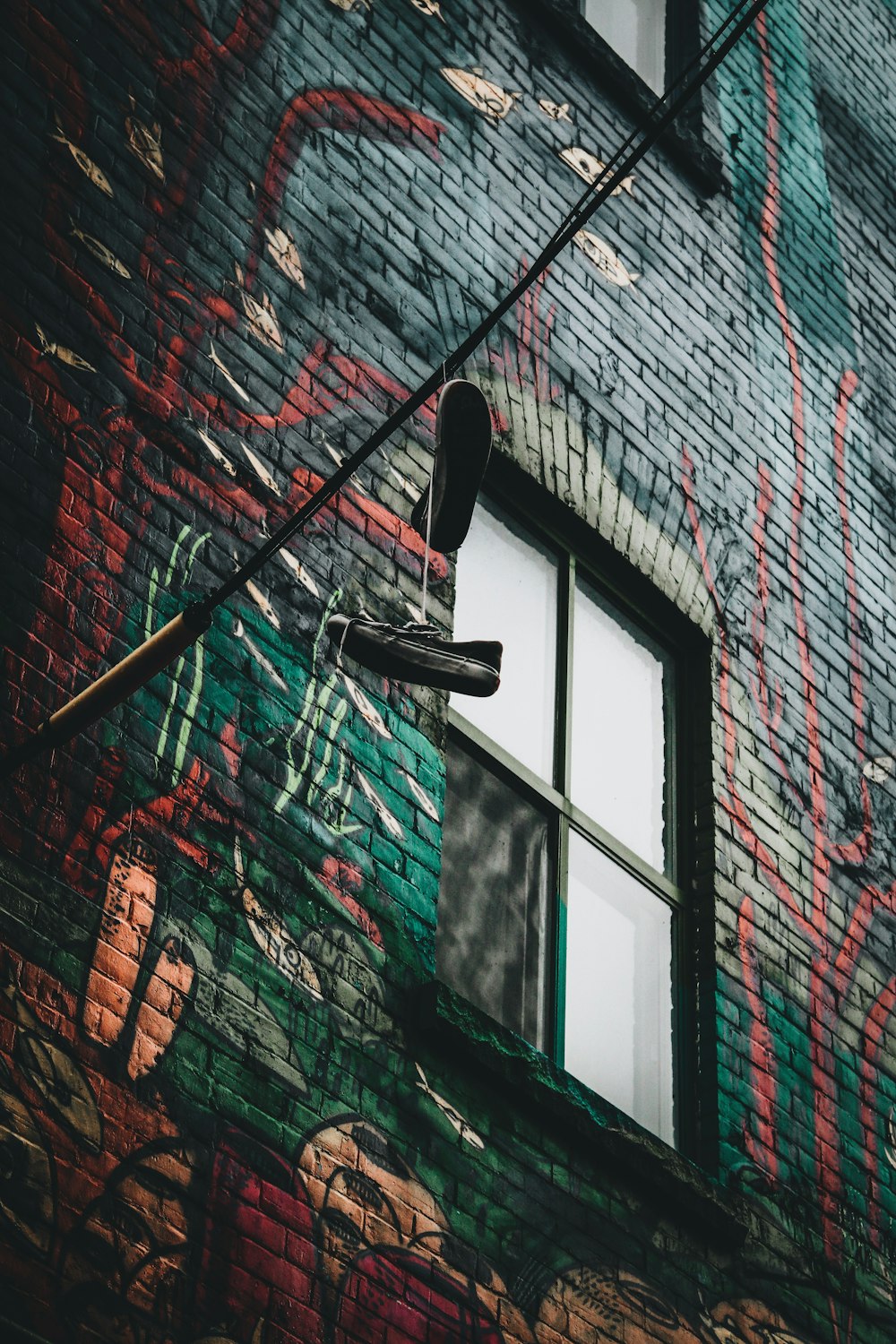 black and white basketball hoop on gray and black concrete wall