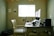 black laptop computer on brown wooden table