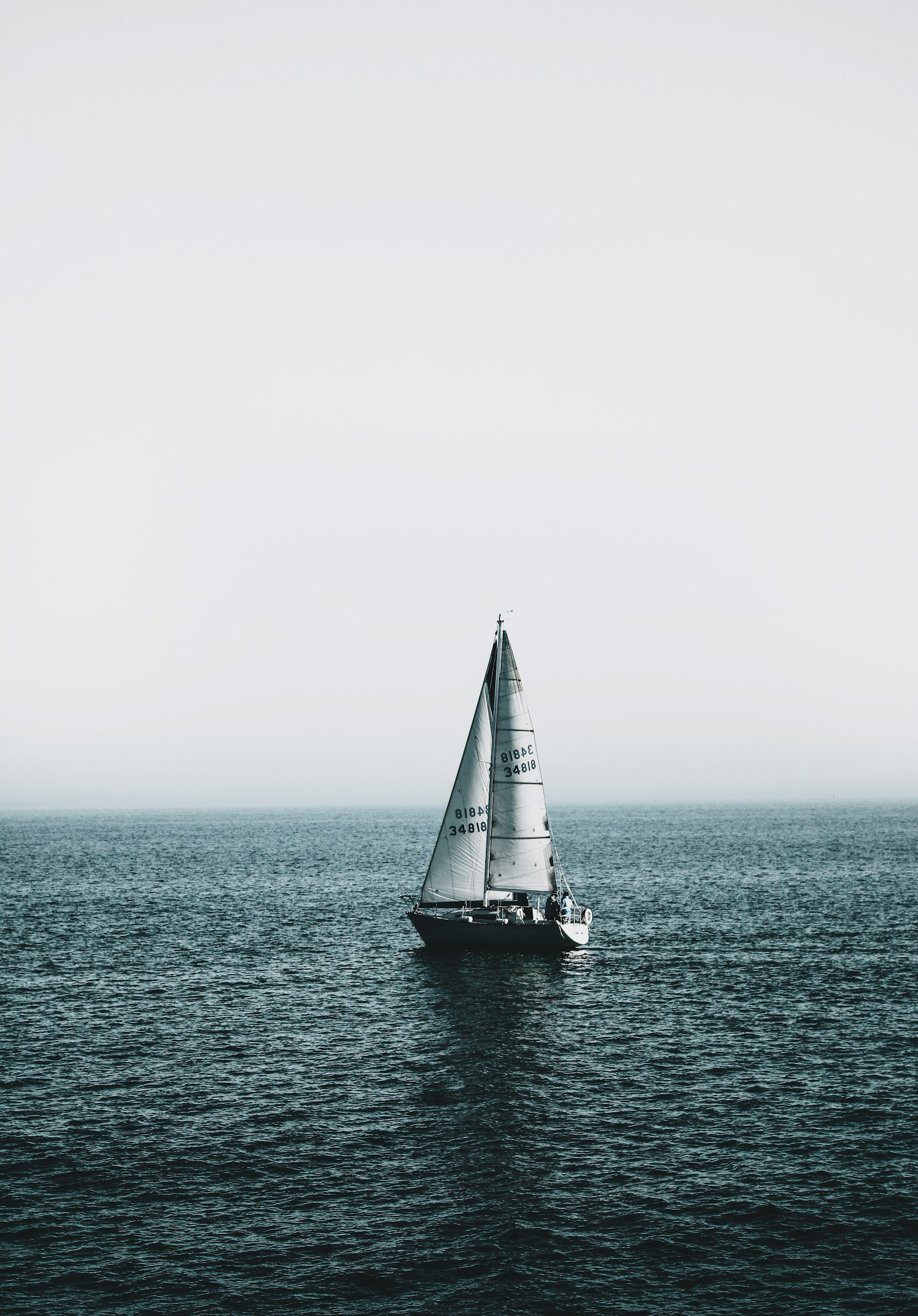Canon EOS 70D + Canon EF-S 18-55mm F3.5-5.6 IS II sample photo. White sailboat on sea photography