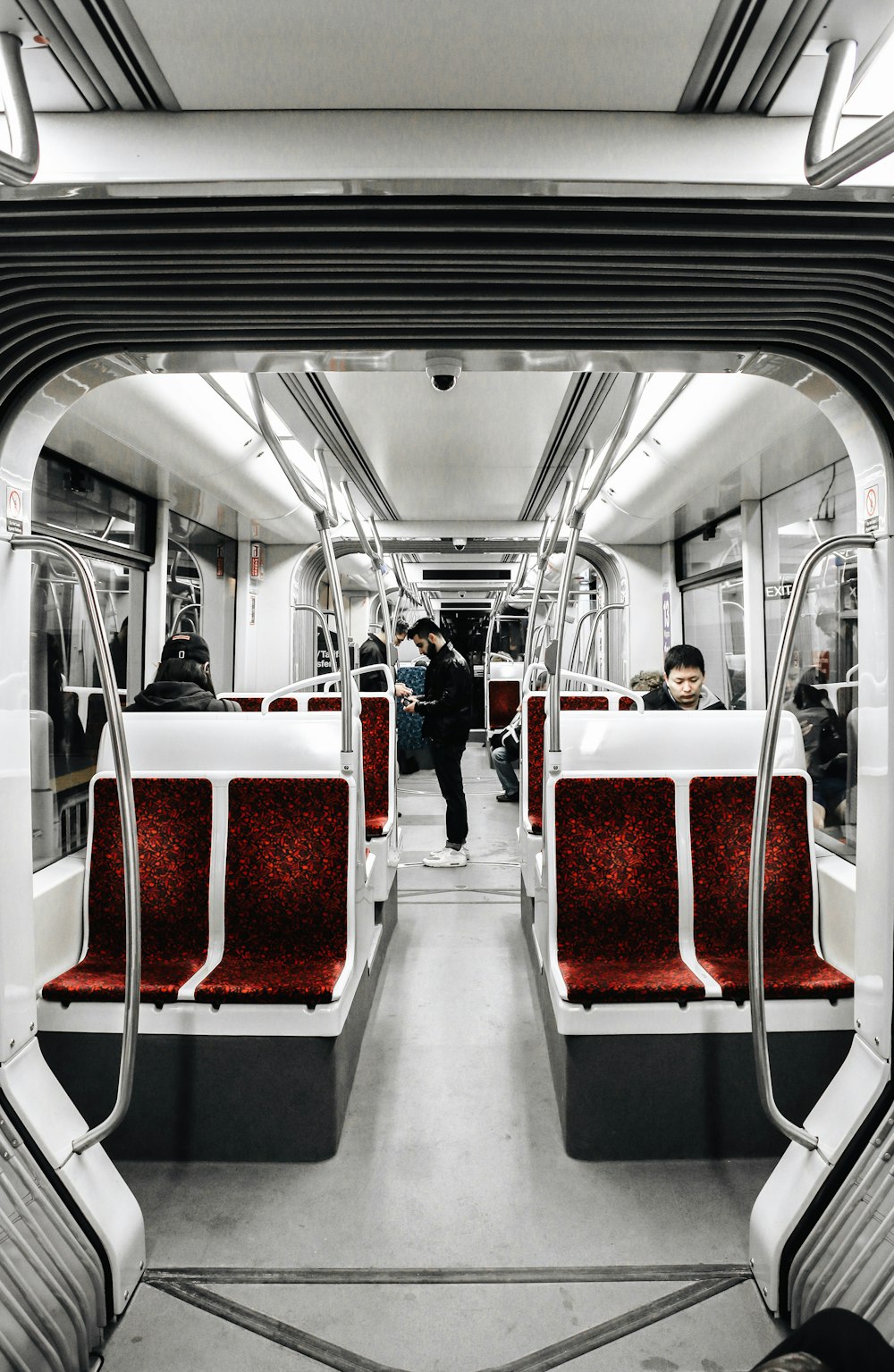 people sitting on train seat