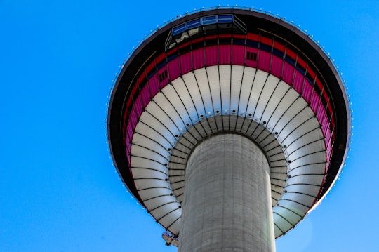 white and red round building in Calgary Tower Canada