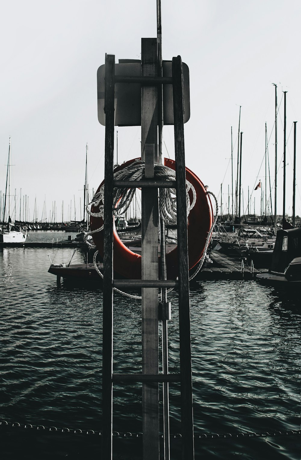 red and black boat on sea during daytime