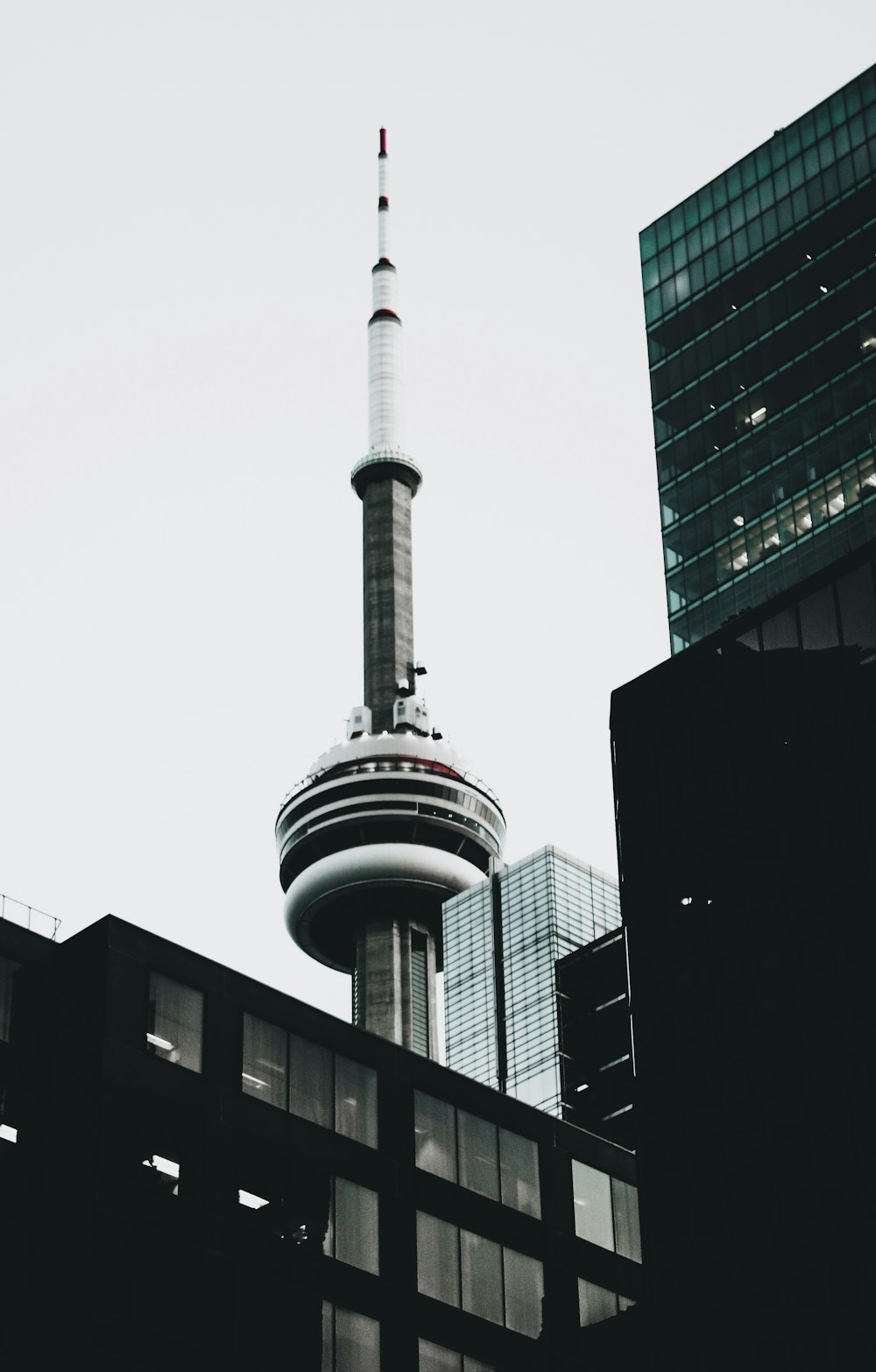 white and black tower under white sky during daytime