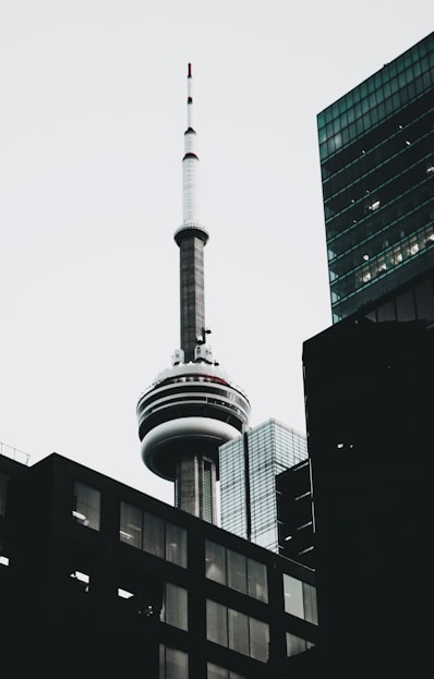 white and black tower under white sky during daytime