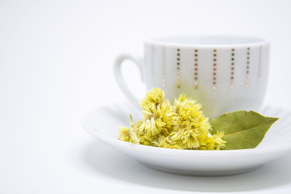 white ceramic mug with yellow powder