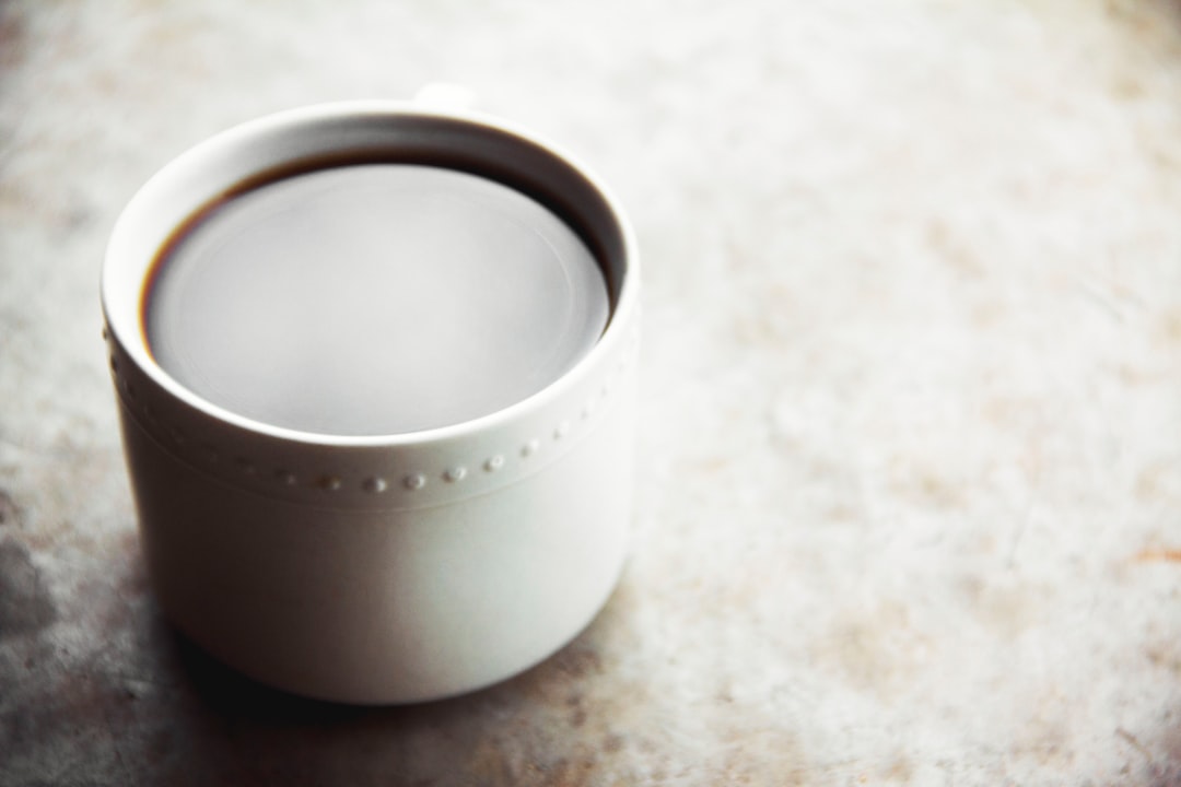 white round container on white table