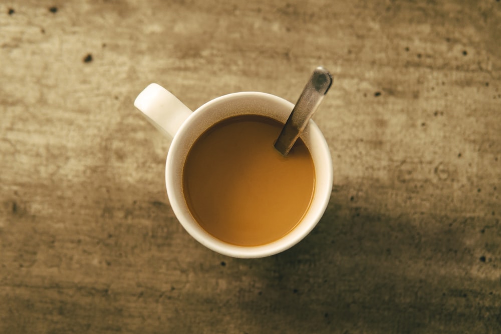 white ceramic mug with coffee