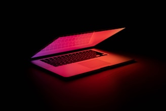 macbook pro on brown wooden table