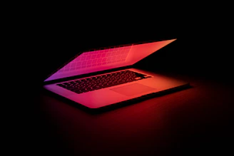 macbook pro on brown wooden table