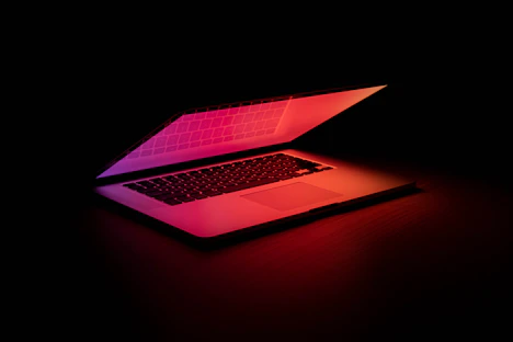 macbook pro on brown wooden table