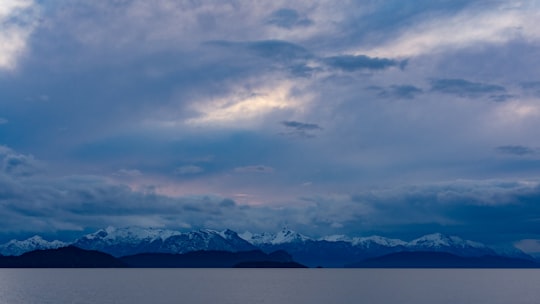 snow covered mountain under cloudy sky during daytime in Lago Nahuel Huapi Argentina