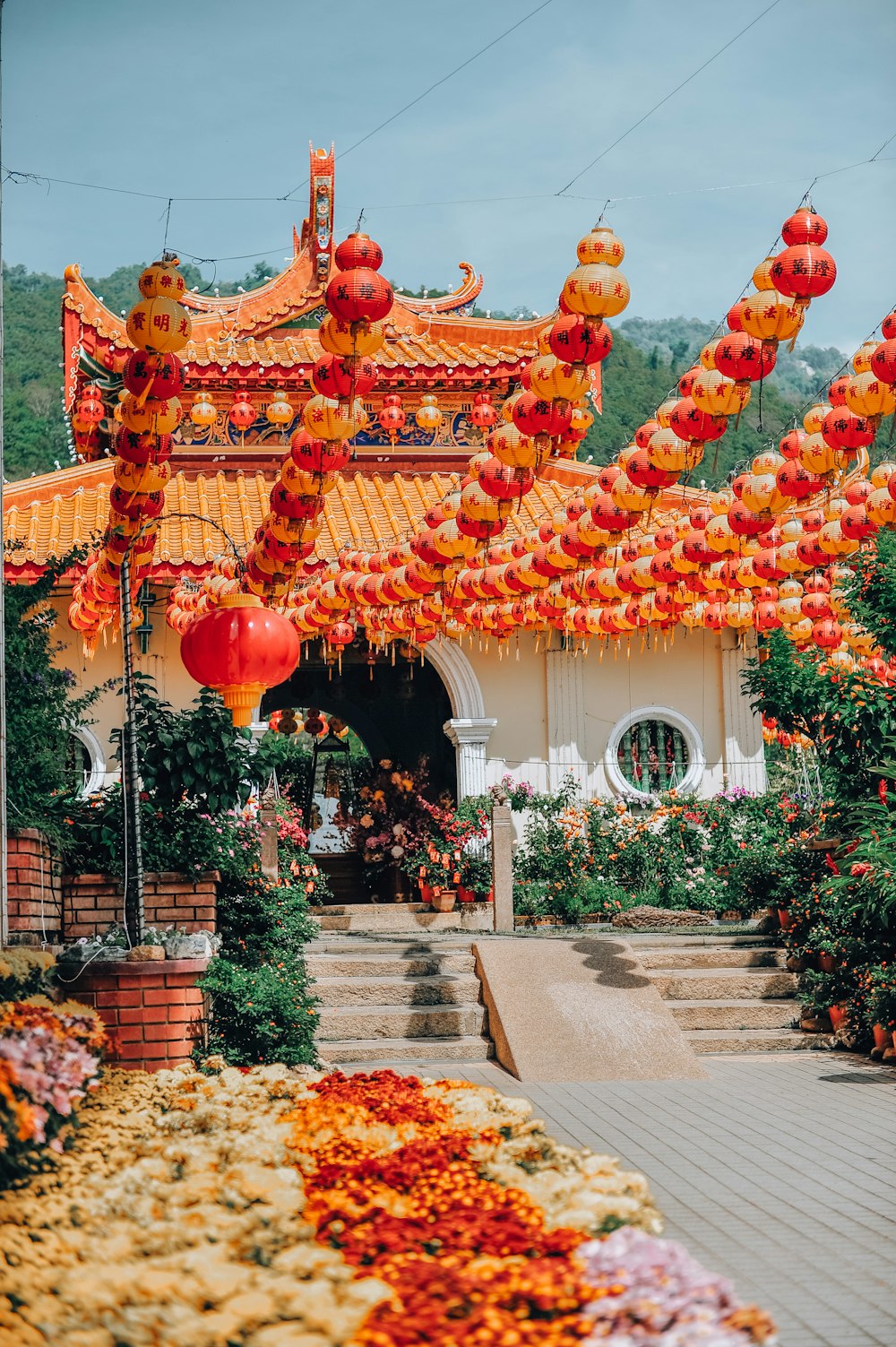 red and yellow chinese lanterns on white concrete building