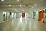 white and brown tiled hallway