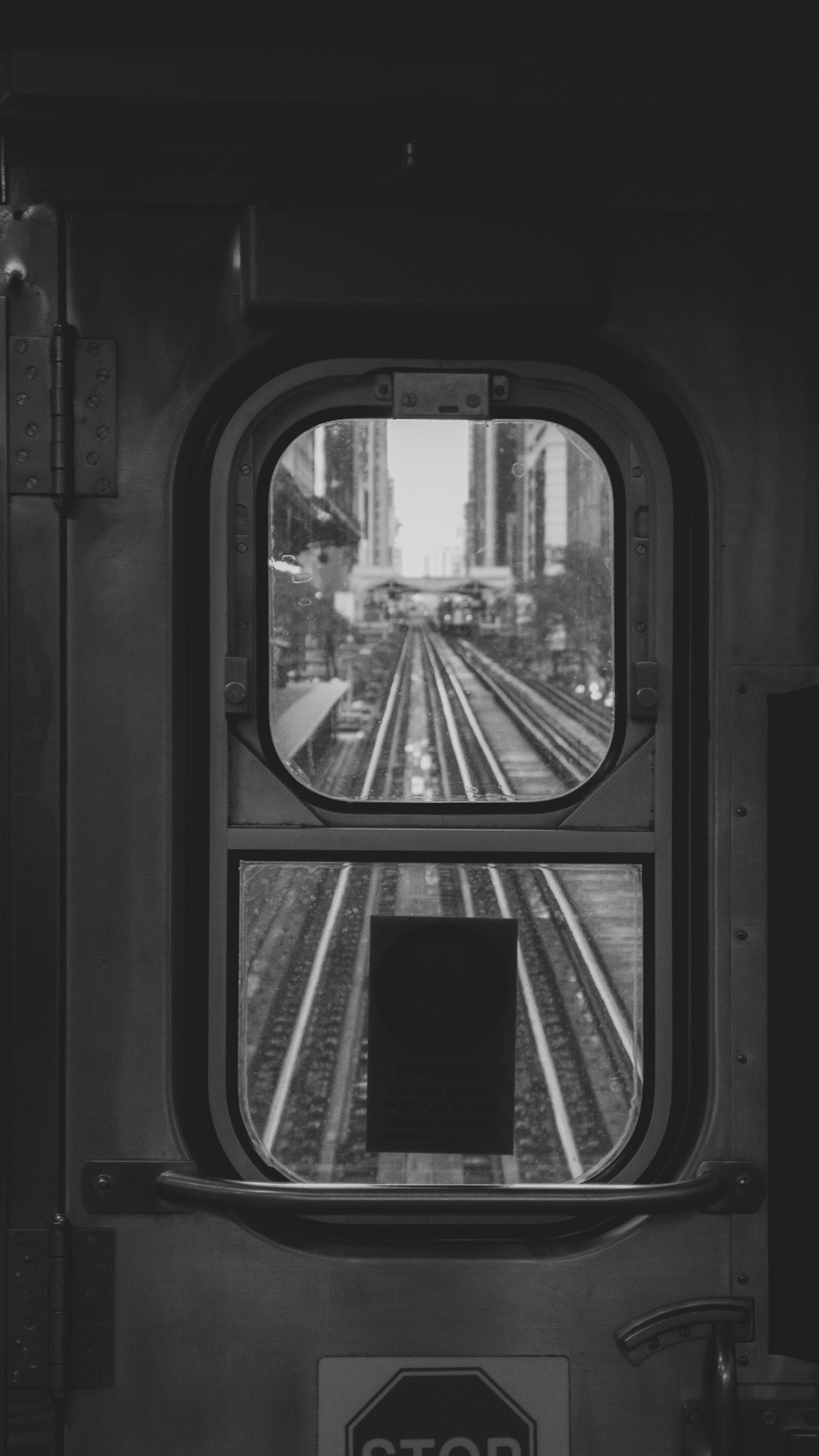 grayscale photo of train window