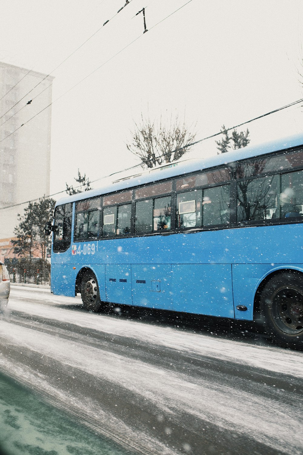 blue and orange bus on road during daytime