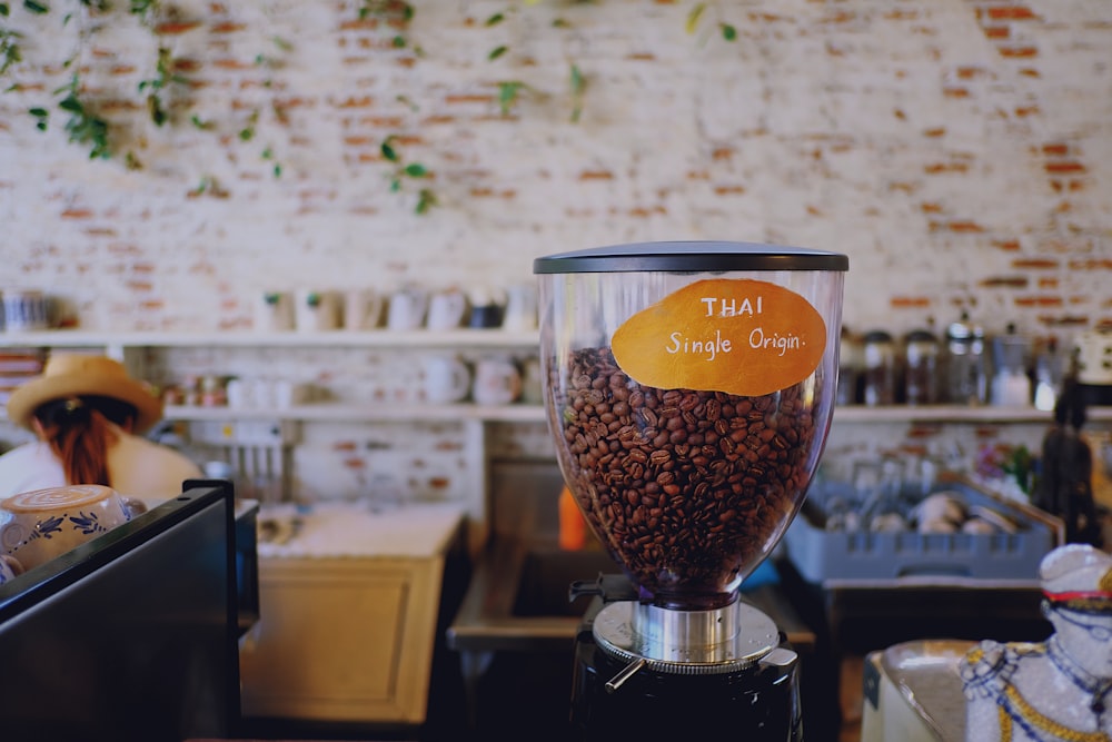 coffee beans in clear glass cup