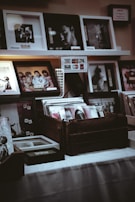 A moody portrait of a thoughtful man surrounded by vintage music equipment and vinyl records.