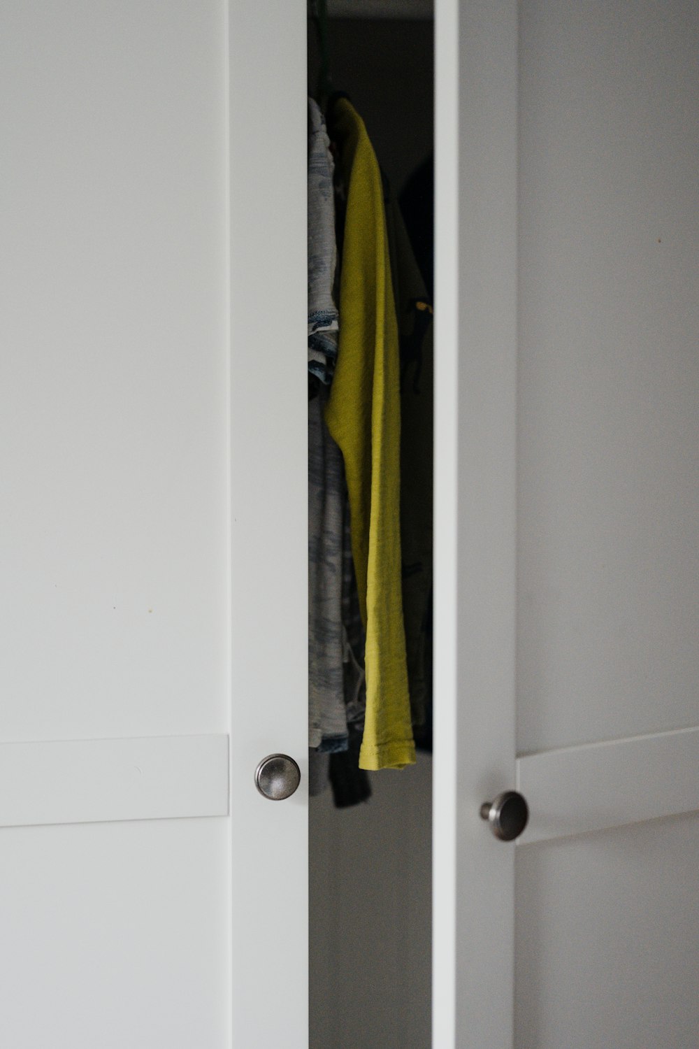 white wooden door with green and yellow textile