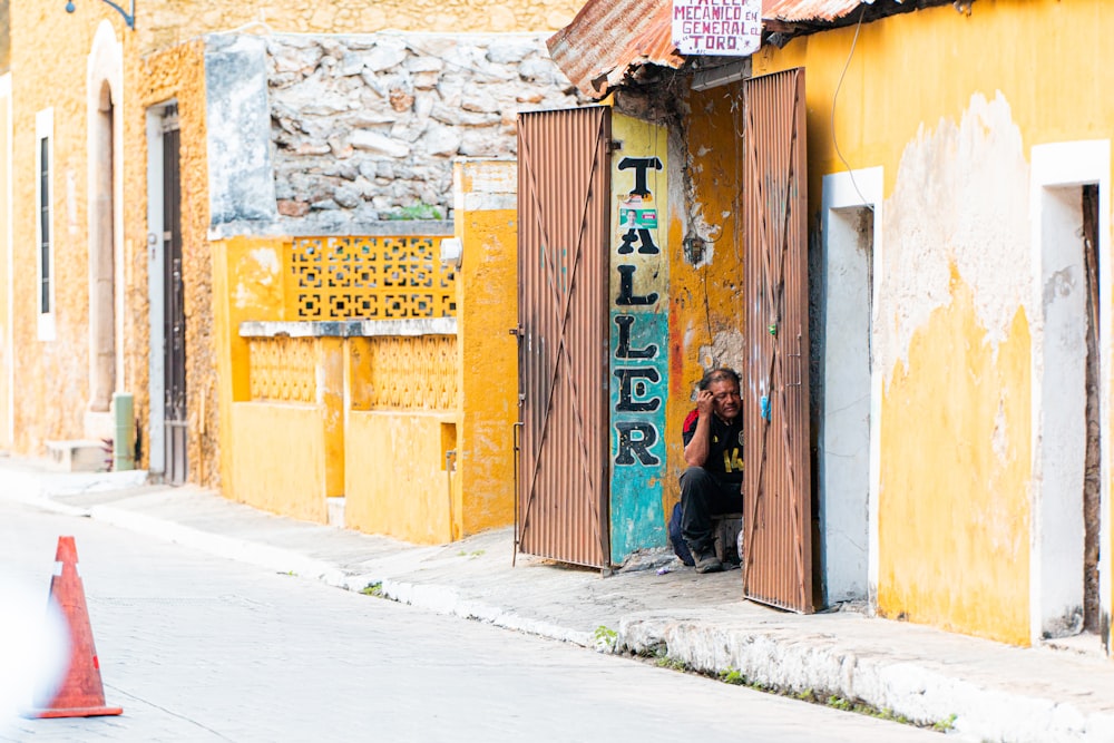 brown wooden door with graffiti