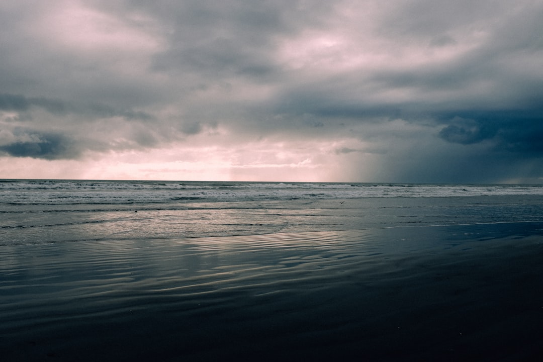 ocean under cloudy sky during daytime