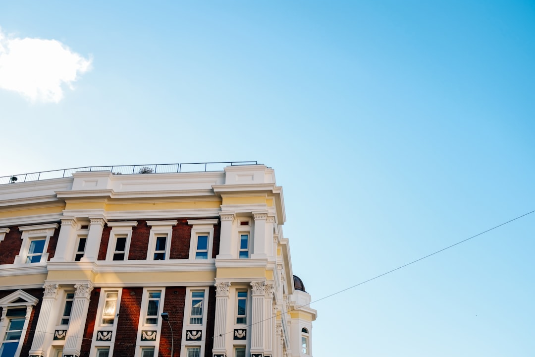 white and brown concrete building under blue sky during daytime