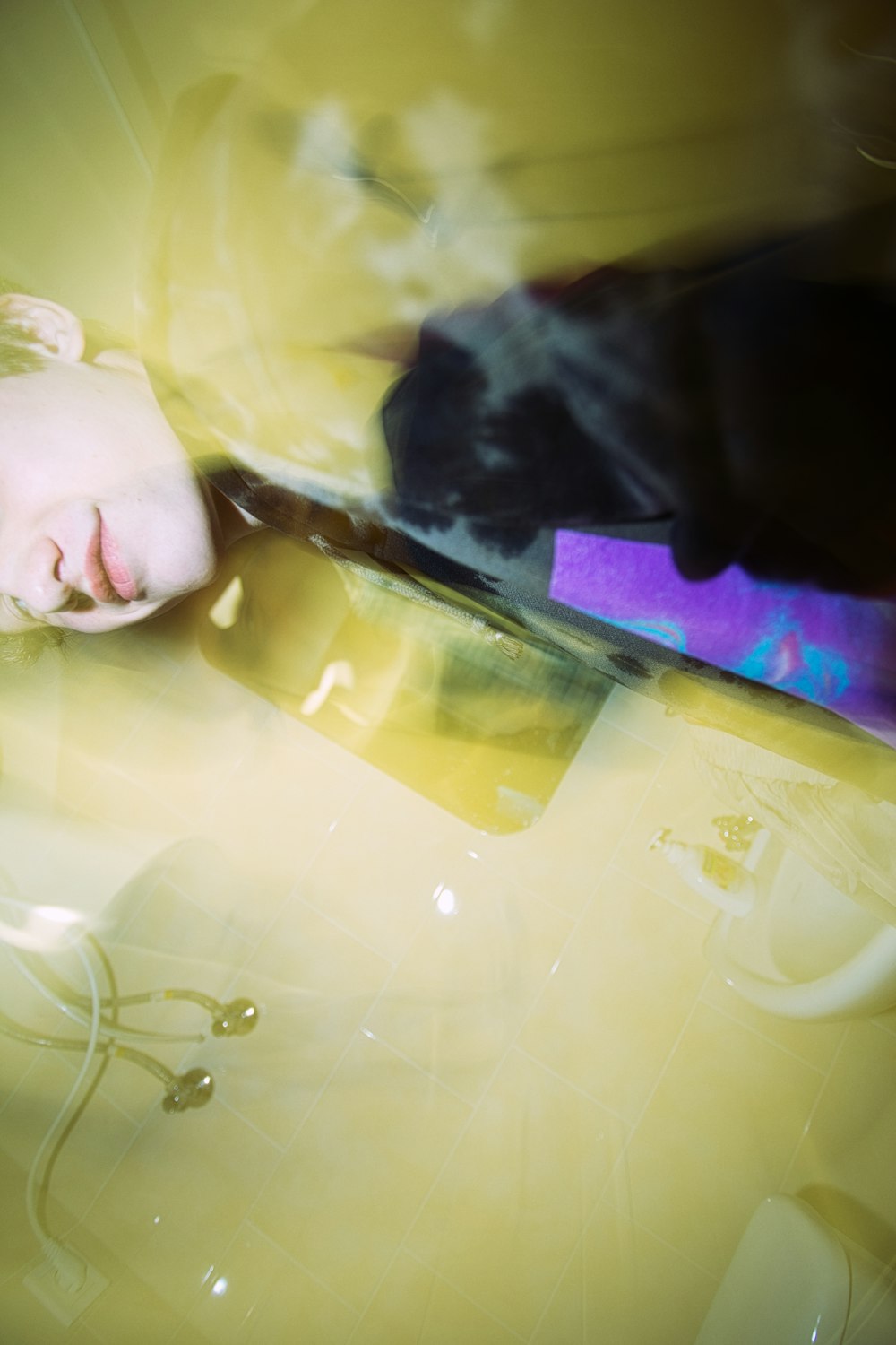 man in black shirt holding clear plastic container