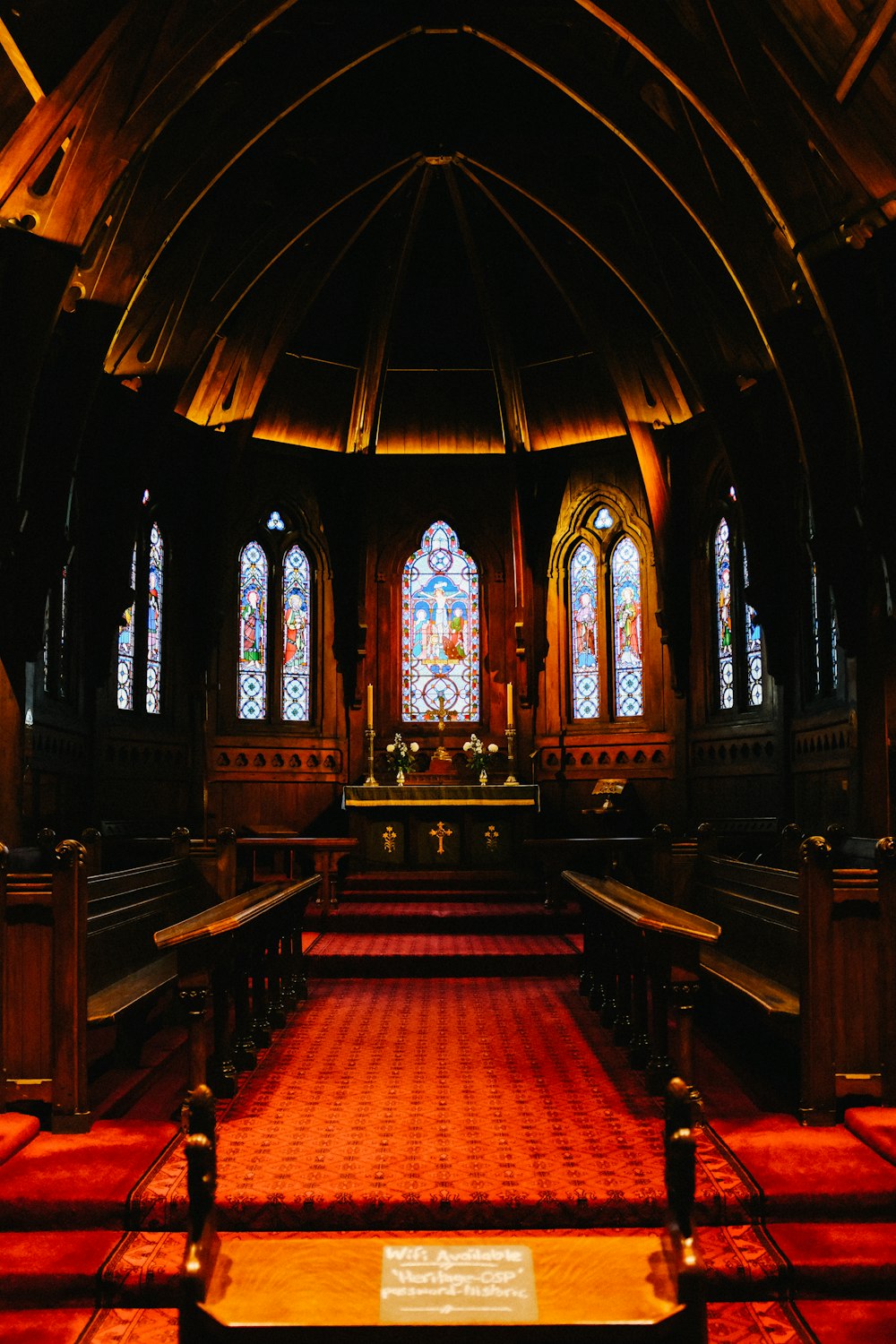 brown wooden bench inside church