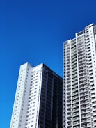 Modern residential buildings in Bhubaneswar under clear blue sky