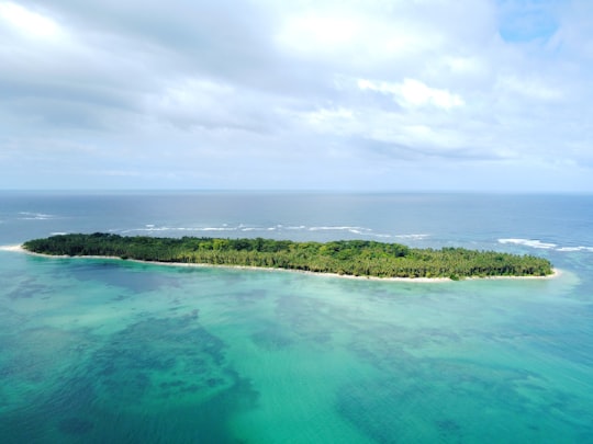 green body of water under cloudy sky during daytime in Cayo Zapatilla Panama