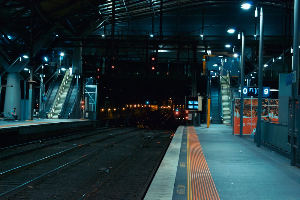 train rail in a city during night time