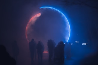 silhouette of people standing on stage