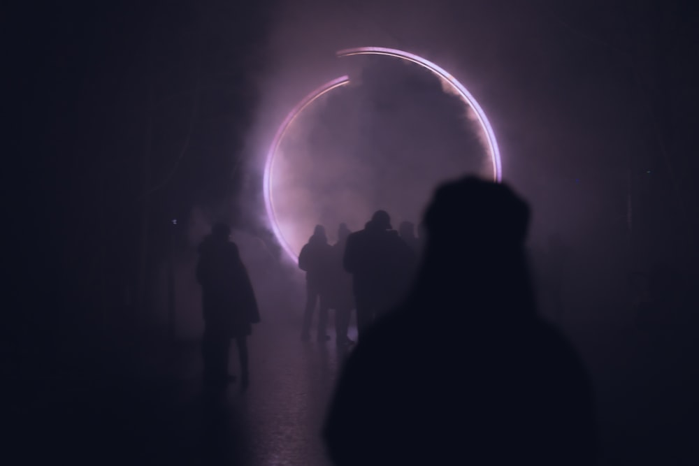 silhouette of people standing on the stage