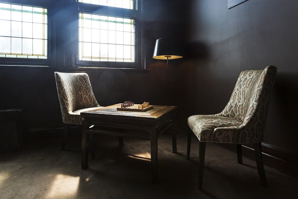 brown wooden table with white padded chair