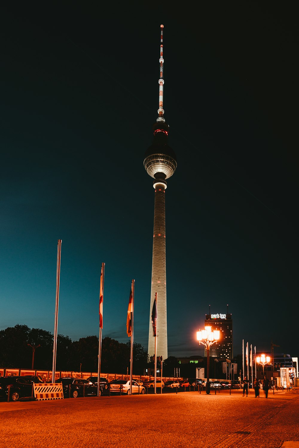 white and red tower during night time