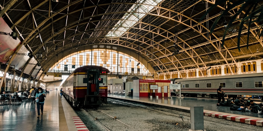 red and white train in train station