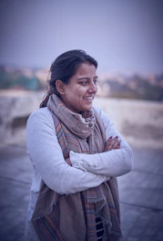 woman in gray long sleeve shirt smiling