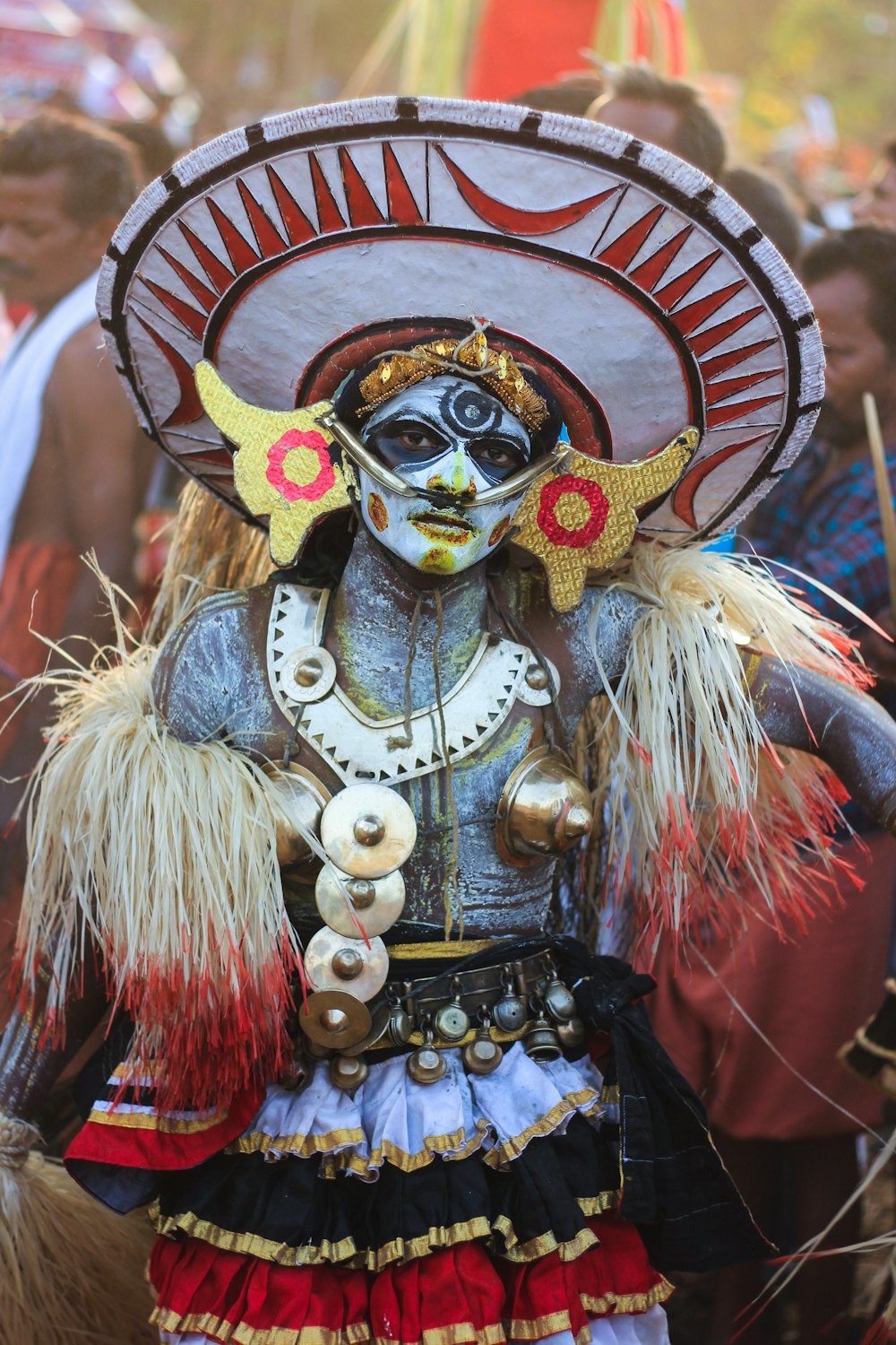 person wearing gold and red mask