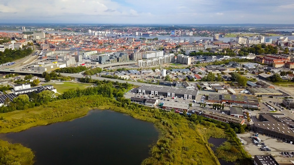 aerial view of city buildings near river during daytime