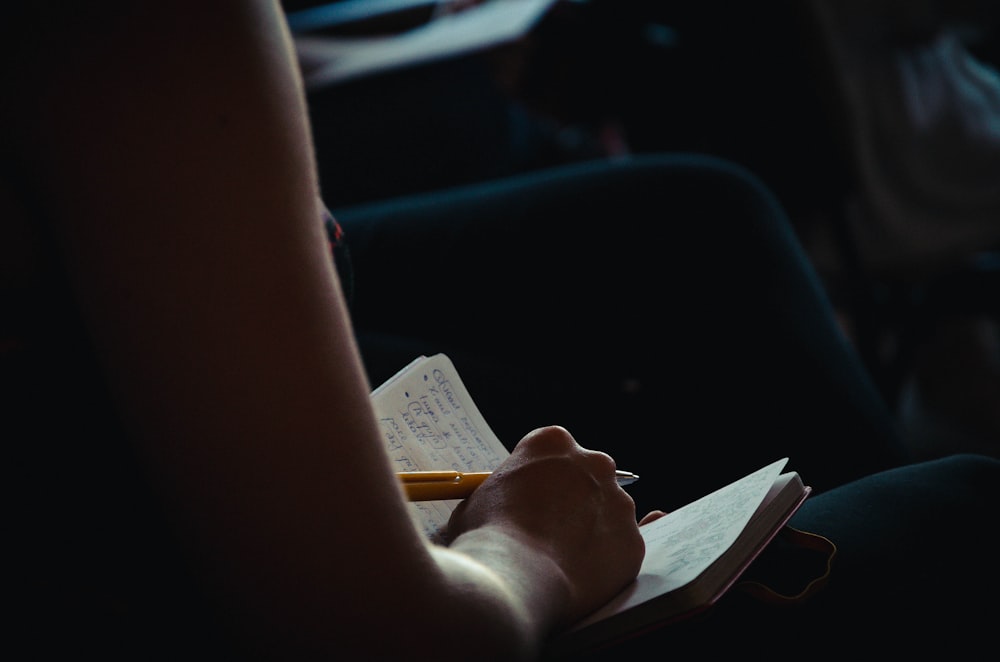 person holding white printer paper